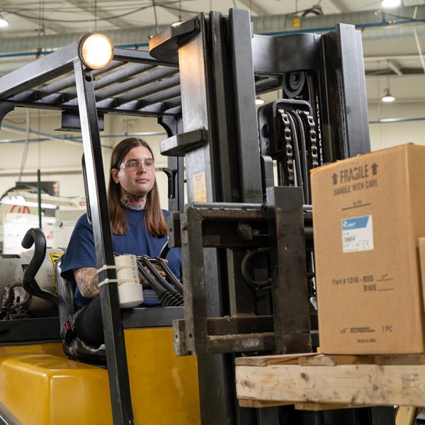 man driving forklift