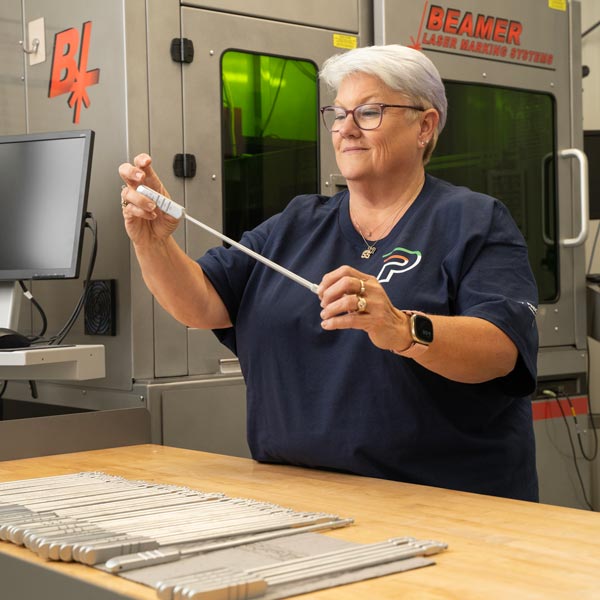 woman holding surgical instrument